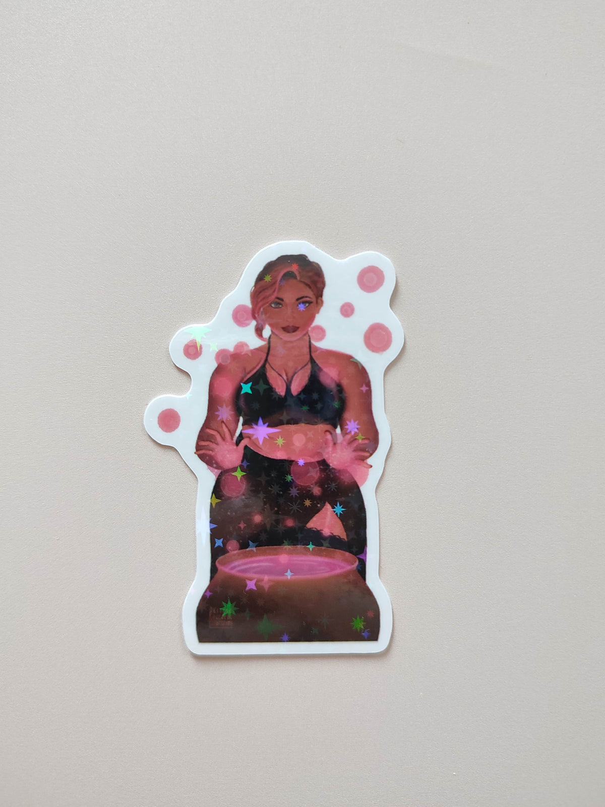 sticker Stella posé sur un fond crème neutre en gros plan